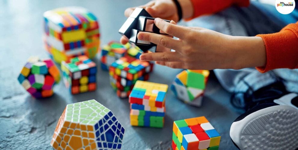 Child solving colorful puzzles, enhancing problem-solving skills in a playful setting.